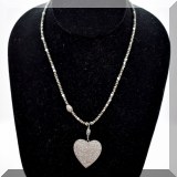 J126. Beaded necklace with pave diamond heart pendant.
